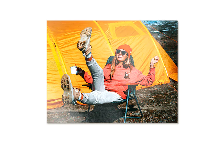 Aluminium photo print of a moutain and a lake being held by woman made by Printerpix