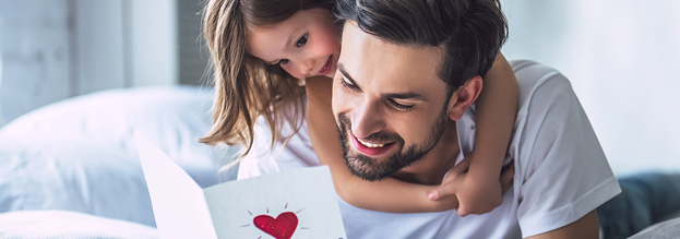 Girl gives Father's Day card