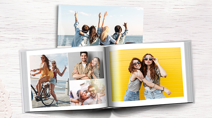 A photobook spread open with photos of young friends.