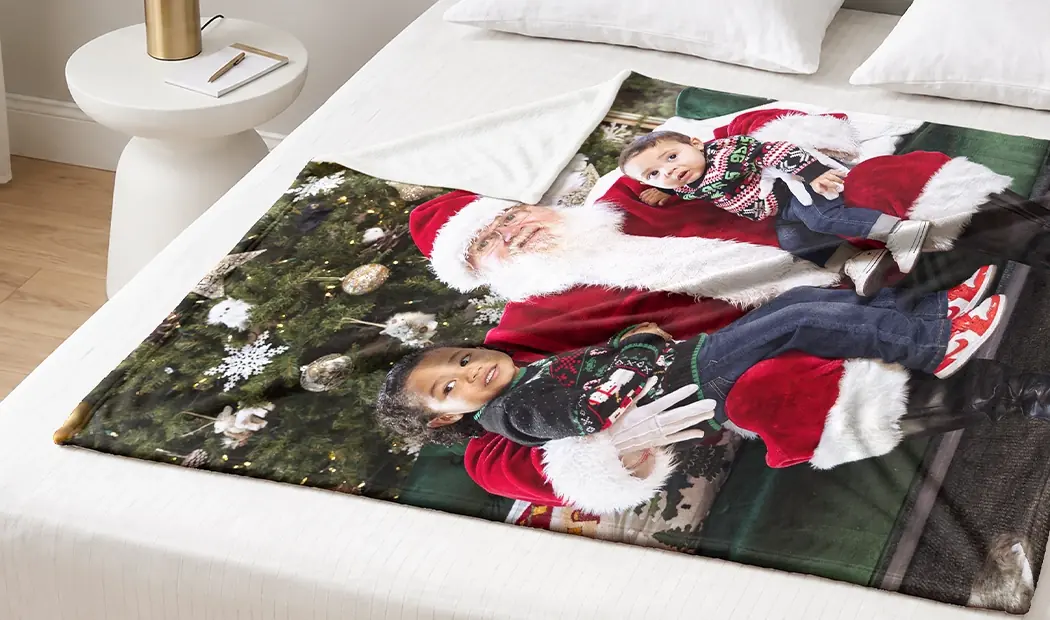 A photo blanket printed with a family photo taken with Father Christmas