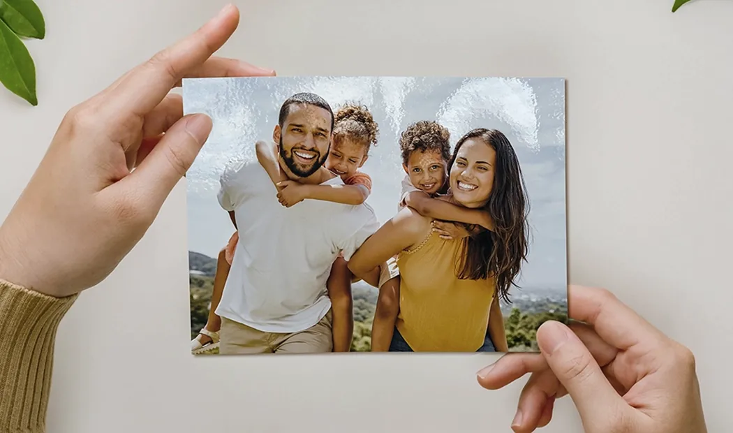 Stack of custom photo prints from the Printerpix online photo printing service