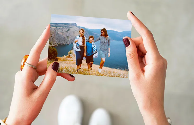Stack of custom photo prints from the Printerpix online photo printing service