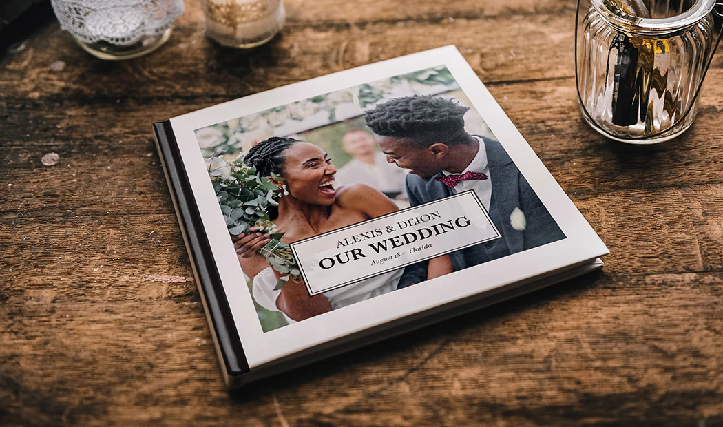 Custom printed Printerpix photo album with hard cover and large photos of young couple