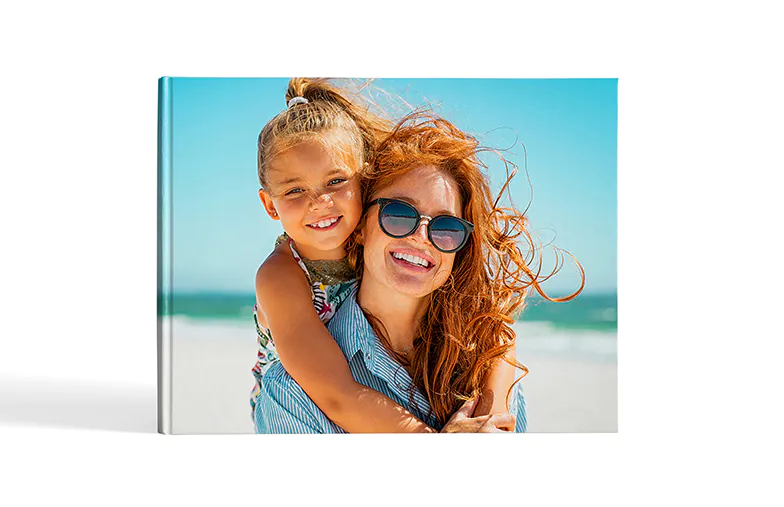 Custom printed Printerpix photo album with hard cover and large photos of young couple