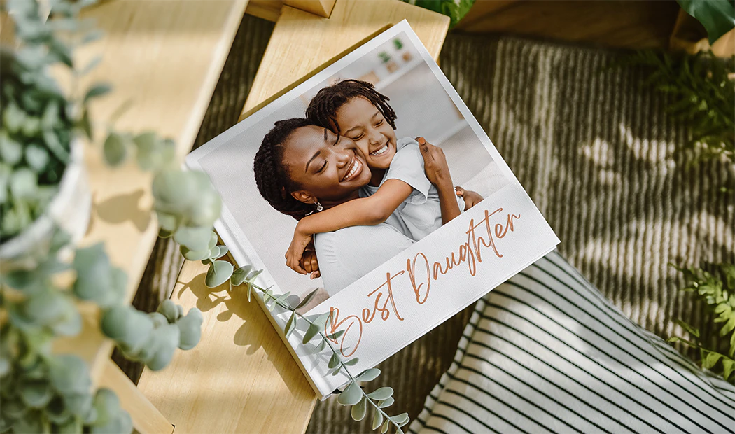 Custom printed Printerpix photo album with hard cover and large photos of young couple