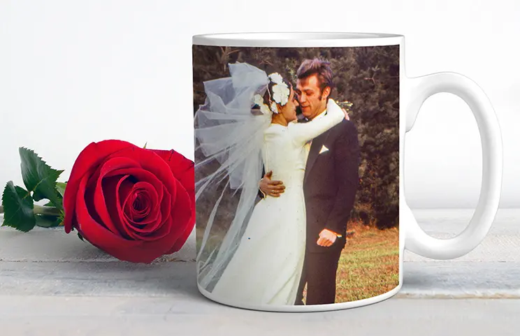 Personalised photo mug with picture of baby crawling wearing animal overall