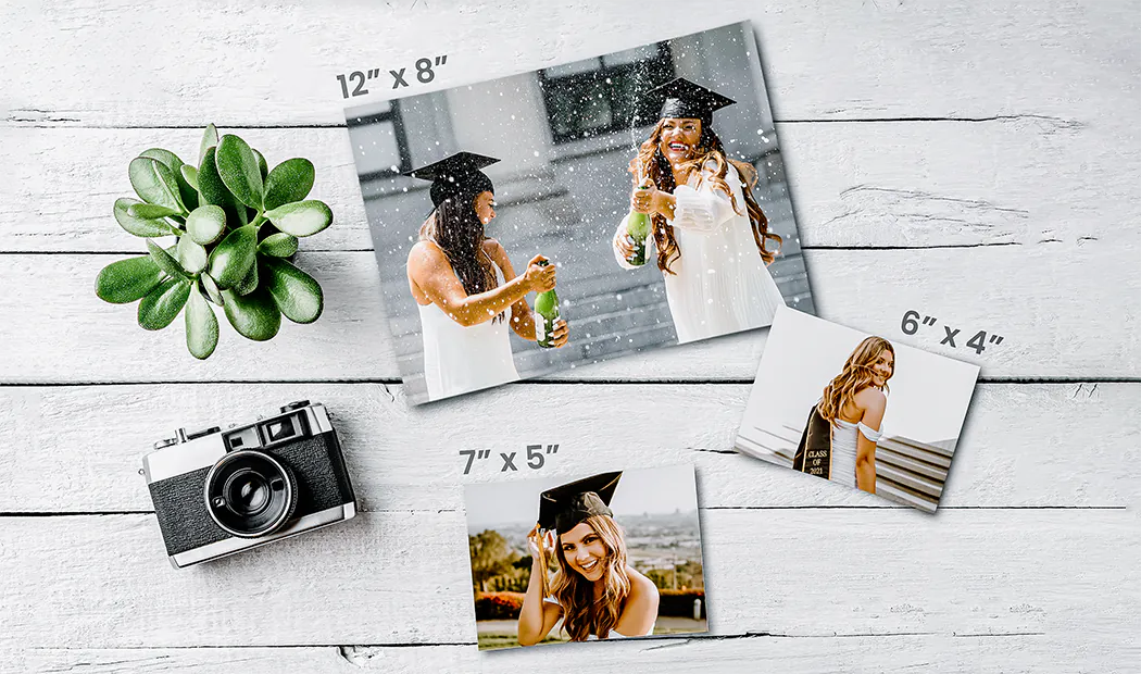 Small medium and large photo prints on table from mobile phone