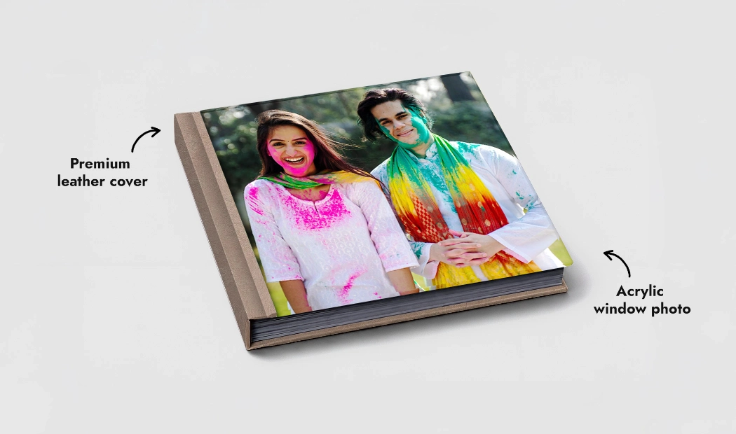 Leather Cover Custom Photo Book by Printerpix|Custom Printerpix photo book with leather cover and personalized design|Custom made photo book open on table with photo collage of family photos|Wedding and bride photos in custom printed photo album by Printerpix|Couple look at leather cover custom photo book made by Printerpix|Old couple print large custom photos in leather photo album|||||