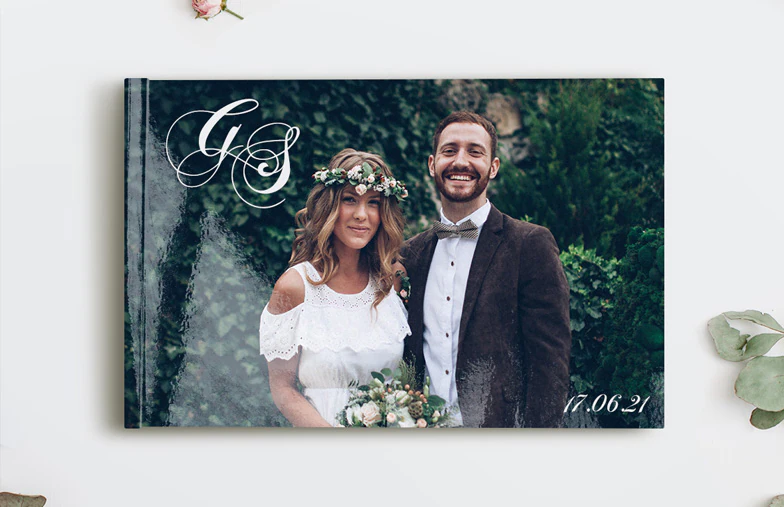Printed personalized photo book with pictures of mother and son and photo cover