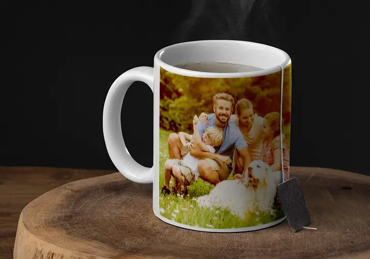 Mom and daughter holding custom designed photo mugs with family photos