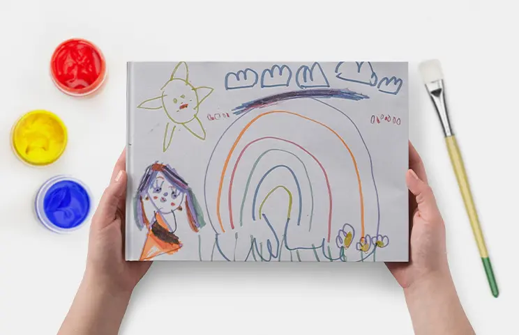 Hardcover Custom Photo Book|Custom printed Printerpix photo album with hard cover and large photos of young couple|Printed personalized photo book with pictures of mother and son and photo cover|Holiday photo album with custom photo printed cover|Personalized photo book printed with pictures of the football team and the photo cover|Family photo album with custom printed cover and family name text|||||