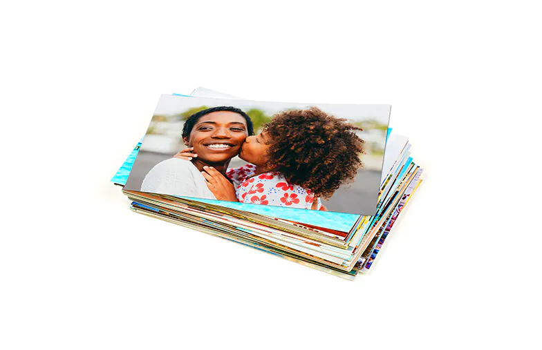 Stack of custom photo prints from the Printerpix online photo printing service