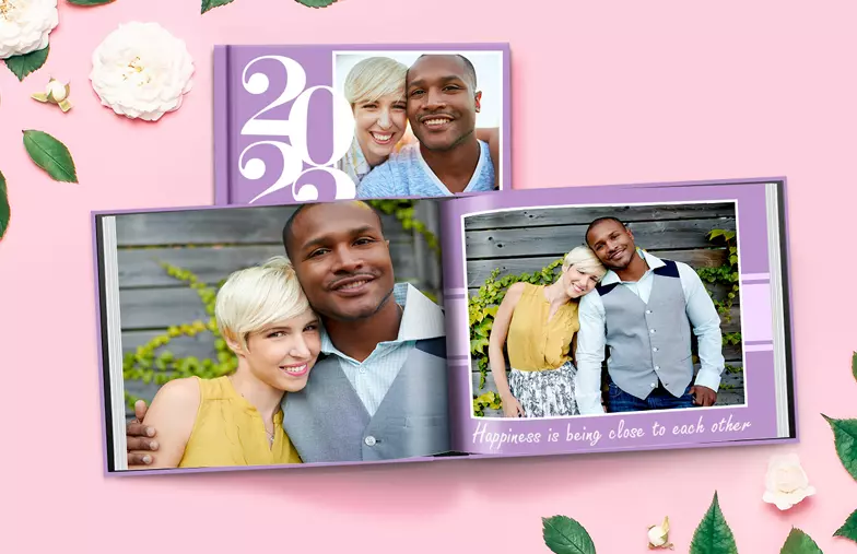 Hardcover Custom Photo Book|Custom printed Printerpix photo album with hard cover and large photos of young couple|Printed personalized photo book with pictures of mother and son and photo cover|Holiday photo album with custom photo printed cover|Personalized photo book printed with pictures of the football team and the photo cover|Family photo album with custom printed cover and family name text|||||