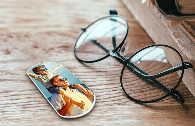 Keychain of son on father's shoulders in use