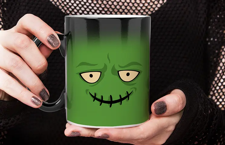 Magic Mug|Three mugs, being filled with hot water to reveal a baby.|Young boy holding custom designed magic mug with photo of himself on|Magic mug with picture of cat on having tea poured into it on desk|Couple holding two heat changing magic mugs with custom text by Printerpix|Three mugs: one empty (blank), one half full (half an image) and one full (full image)|Grandad and grand daughter holding hands with personalised mug with photo of grand daughter||||