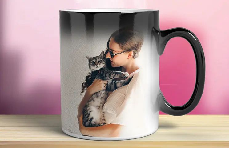 Three mugs, being filled with hot water to reveal a baby.