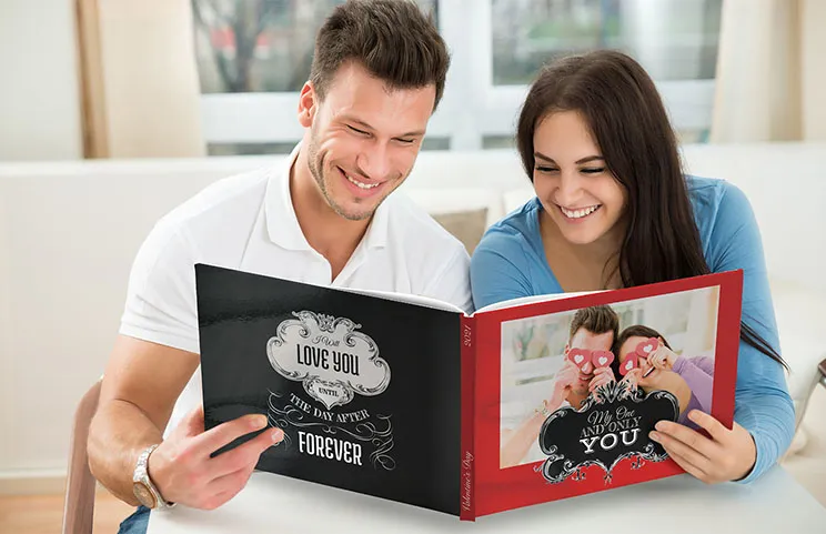 Hardcover Custom Photo Book|Custom printed Printerpix photo album with hard cover and large photos of young couple|Printed personalized photo book with pictures of mother and son and photo cover|Holiday photo album with custom photo printed cover|Personalized photo book printed with pictures of the football team and the photo cover|Family photo album with custom printed cover and family name text|||||