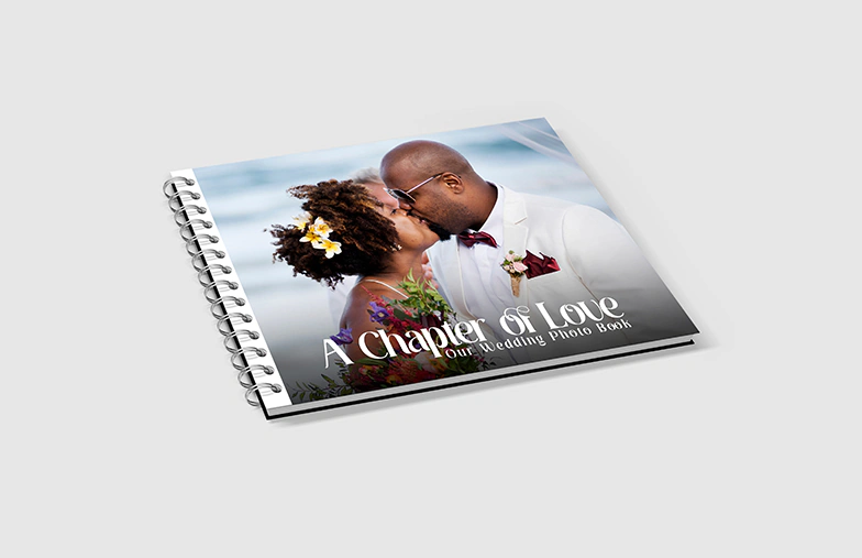 Spiral Bound Photo Book||A spiral book on a table with a baby on the cover||A spiral book open with two photos of a baby||||||