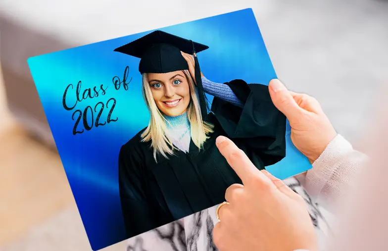 Metal Photo Print by Printerpix|Aluminium photo print of a moutain and a lake being held by woman made by Printerpix|Metal photo print of mom and daughter on bookshelf|A metal print on a wall with a landscape shot; a small metal print of two dogs|A metal print of a bridge with a city skyline in the background|Three metal prints of different sizes showing different landscapes|||||