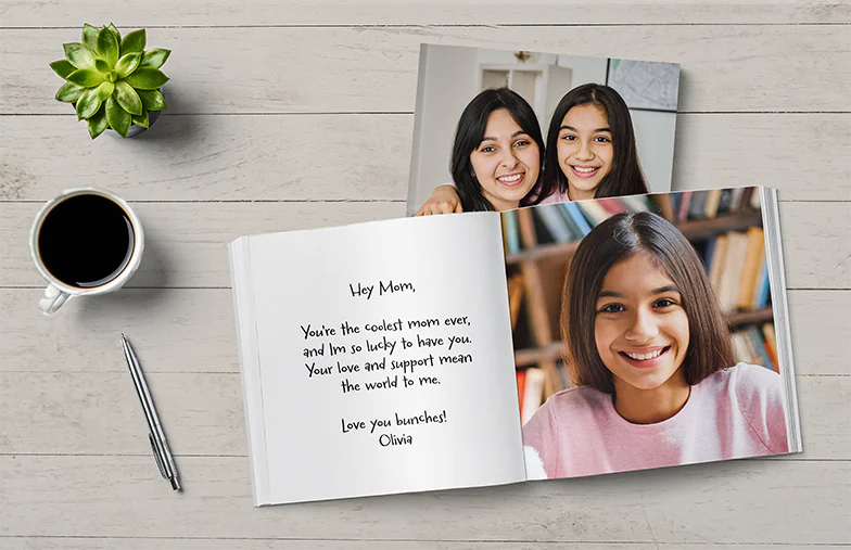 Custom printed Printerpix photo album with hard cover and large photos of young couple