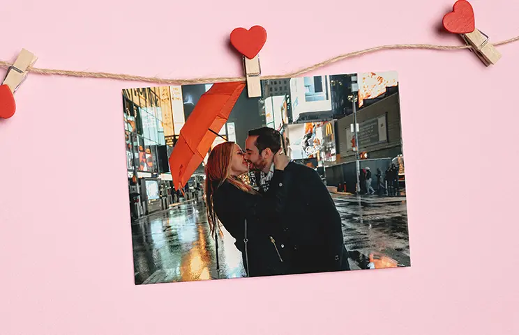 Online Photo Printing by Printerpix|Stack of custom photo prints from the Printerpix online photo printing service|Small medium and large photo prints on table from mobile phone|Photo Prints|Hands holding a photo print of three kids on holiday|Range of sizes of online photo prints of photos taken by mobile phone of family|||||