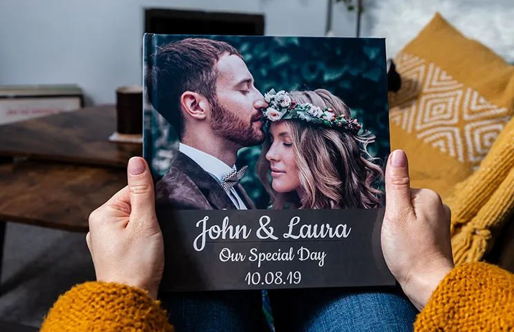 Custom printed Printerpix photo album with hard cover and large photos of young couple