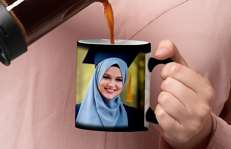 Magic Mug|Three mugs, being filled with hot water to reveal a baby.|Young boy holding custom designed magic mug with photo of himself on|Magic mug with picture of cat on having tea poured into it on desk|Couple holding two heat changing magic mugs with custom text by Printerpix|Three mugs: one empty (blank), one half full (half an image) and one full (full image)|Grandad and grand daughter holding hands with personalised mug with photo of grand daughter||||
