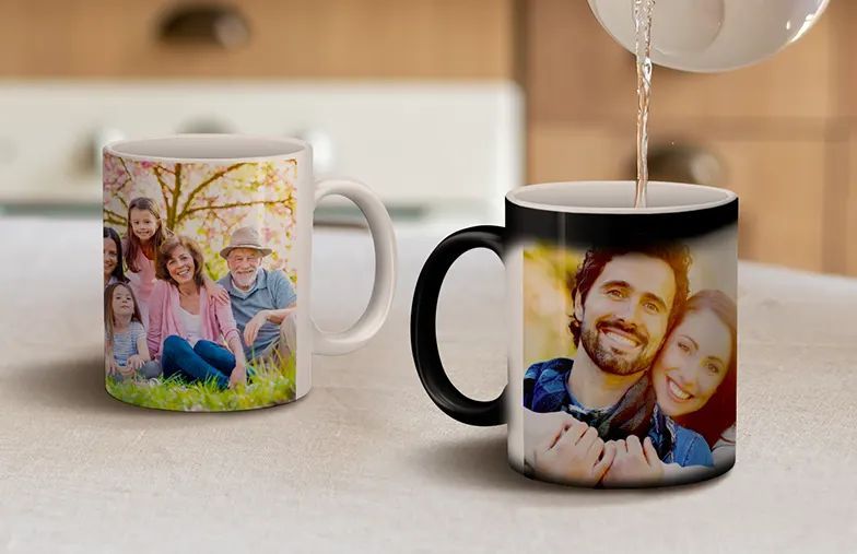 Mom and daughter holding custom designed photo mugs with family photos