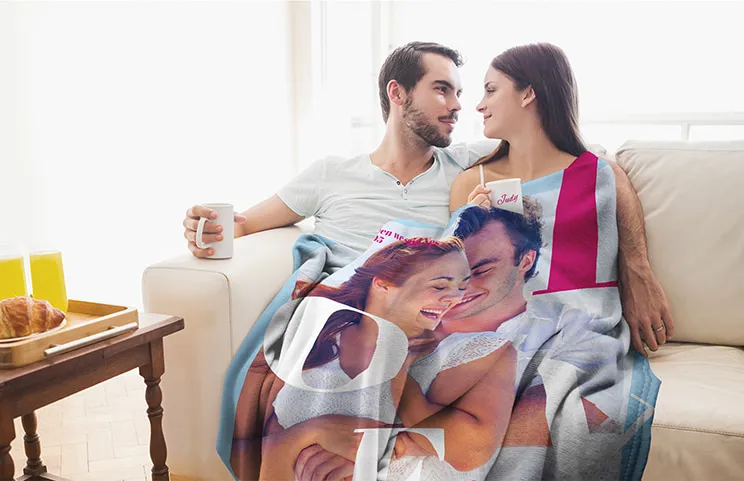 Couple wrapped in custom fleece blanket