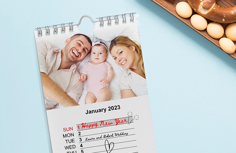 Baby photo with christmas theme design on personalised calendar by Printerpix