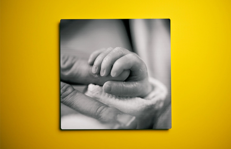 Three metal prints of different sizes showing different landscapes